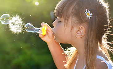 Girl blowing bubbles